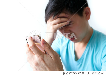 Young caucasian man angry, frustrated and furious with his phone, angry with customer service White background health concept Young caucasian man angry, frustrated and furious with his phone, angry with customer service White background health concept 113442237