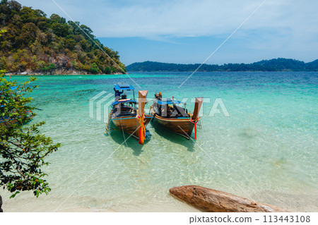 Wooden boat at the clear beach on the island,Long tail boat 113443108