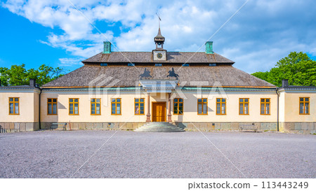 Skogaholm Manor stands proudly under a bright blue sky, showcasing its traditional Swedish architecture and the tranquility of Skansens open-air museum in Stockholm during summer. Sweden Skogaholm Manor stands proudly under a bright blue sky, showcasing its traditional Swedish architecture and the tranquility of Skansens open-air museum in Stockholm during summer. Sweden 113443249