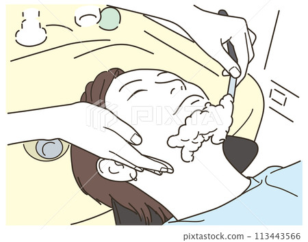 A man getting shaved at a barber shop 113443566