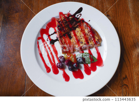 Berry sauce crepe ordered at a cafe Berry sauce crepe ordered at a cafe 113443635