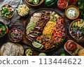 Selection of Mexican food on wood background, top view 113444622