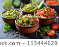 Mexican food - selection of sauces on wood backgruond, menu shot 113444629
