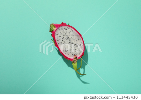 One half of dragon fruit on blue background, top view One half of dragon fruit on blue background, top view 113445430
