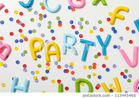 The word "party" from colored plasticine on a white background. The word "party" from colored plasticine on a white background. 113445468
