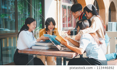group of students young university students consulting doing homework, cooperating research plan Discuss concepts and strategies. Prepare presentations on laptops and tablet computers. group of students young university students consulting doing homework, cooperating research plan Discuss concepts and strategies. Prepare presentations on laptops and tablet computers. 113446892