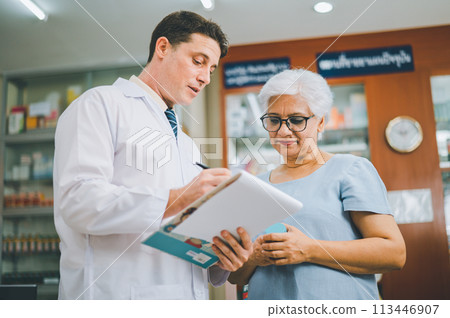 Pharmacist giving advice And advice for patients who come to buy Medicine, Drugs, Vitamins products, according to prescriptions in modern pharmacies. 113446907