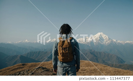 A young happy Chinese man with a tourist backpack stands on top of a rock in the mountains, travels and enjoys a beautiful view of the mountains, sky or nature. Untouched nature. Tourism and travel A young happy Chinese man with a tourist backpack stands on top of a rock in the mountains, travels and enjoys a beautiful view of the mountains, sky or nature. Untouched nature. Tourism and travel 113447377