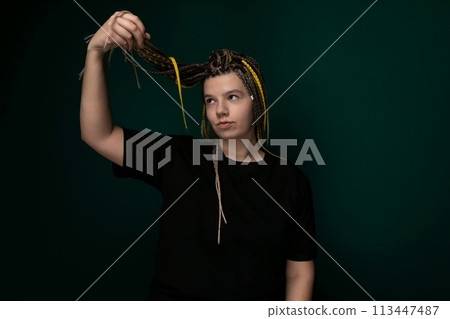Woman With Braids Holding Scissors Woman With Braids Holding Scissors 113447487