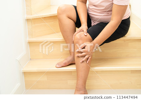 Asian lady fall down the stairs and pain at knee because slippery surfaces. 113447494