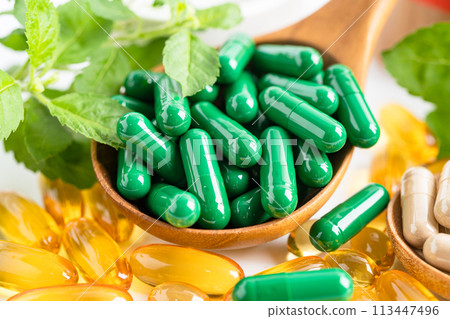 Alternative medicine herbal organic capsule with vitamin E omega 3 fish oil, mineral, drug with herbs leaf natural supplements for healthy good life. 113447496