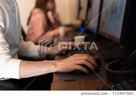 Hands of a man enjoying a game 113447560