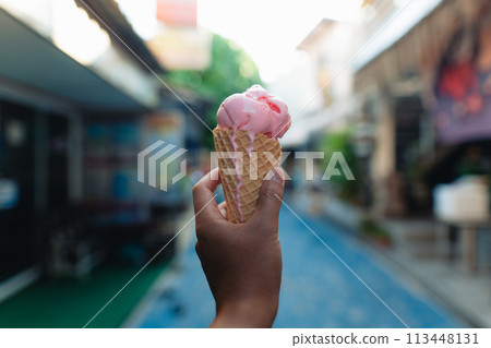 Eating ice cream in the streets of 113448131