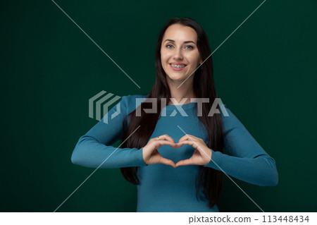 Woman Making Heart Shape With Hands Woman Making Heart Shape With Hands 113448434