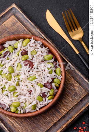 Delicious white cooked rice with green edamame beans with salt and spices 113448804