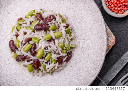 Delicious white cooked rice with green edamame beans with salt and spices 113448857
