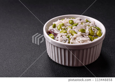Delicious white cooked rice with green edamame beans with salt and spices 113448858