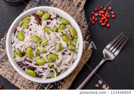 Delicious white cooked rice with green edamame beans with salt and spices Delicious white cooked rice with green edamame beans with salt and spices 113448859