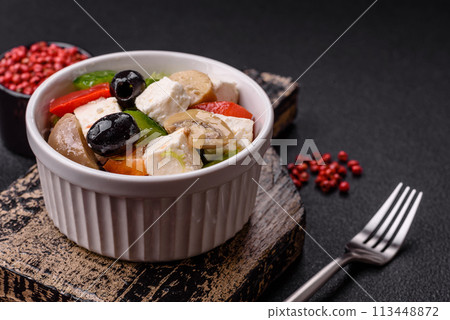 Delicious fresh juicy salad of sweet peppers, cheese, olives, tomatoes, cucumbers 113448872