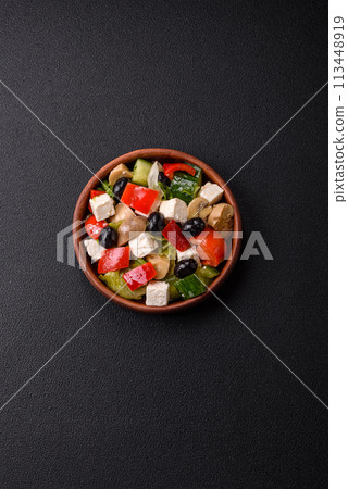 Delicious fresh juicy salad of sweet peppers, cheese, olives, tomatoes, cucumbers 113448919
