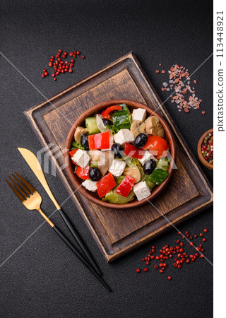 Delicious fresh juicy salad of sweet peppers, cheese, olives, tomatoes, cucumbers Delicious fresh juicy salad of sweet peppers, cheese, olives, tomatoes, cucumbers 113448921