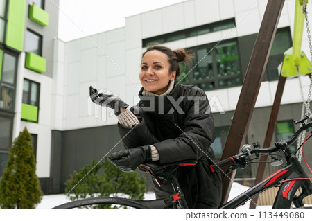 European young woman enjoying her weekend riding her bike 113449080