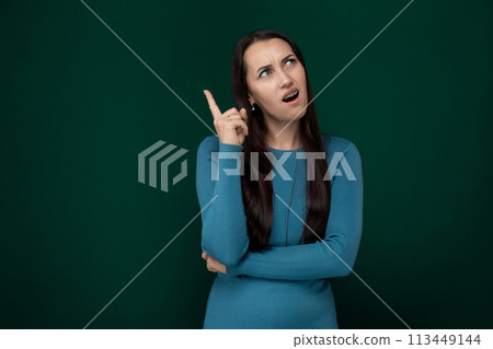 Woman in Blue Dress Making Peace Sign 113449144