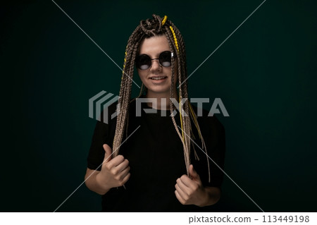 Woman With Dreadlocks Giving a Thumbs Up 113449198
