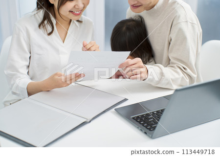 Families considering purchasing insurance 113449718