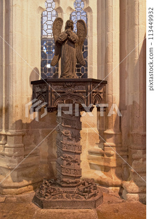 The statue of an angel inside of the St-Corentin Cathedral of Quimper The statue of an angel inside of the St-Corentin Cathedral of Quimper 113449932