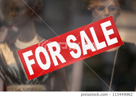 For sale banner in a window shop For sale banner in a window shop 113449962