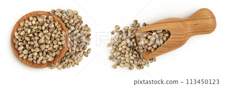 Hemp seeds in wooden bowl and scoop isolated on white background with full depth of field. Top view. Flat lay 113450123