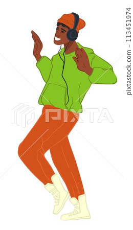 Teenager boy listening to music in headphones 113451974