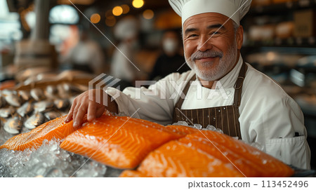 Experienced chef holding large speckled trout fish market. Gourmet seafood concept, gastronomy Experienced chef holding large speckled trout fish market. Gourmet seafood concept, gastronomy 113452496