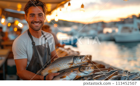 Young fishmonger with fresh catch fish market. Healthy seafood concept for design and lifestyle Young fishmonger with fresh catch fish market. Healthy seafood concept for design and lifestyle 113452507