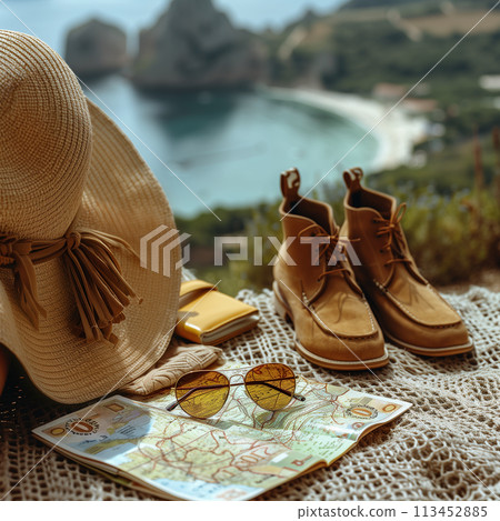 Straw hat and sunglasses on sandy beach with smartphone displaying seascape. Summer, travel concept 113452885