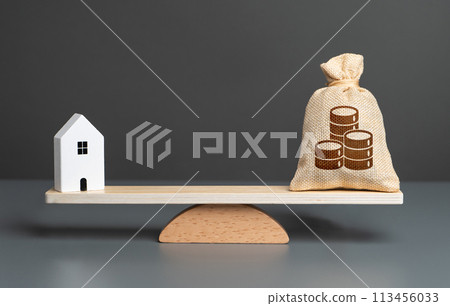 House and money bag with coins on scales. Taxes. Buying and selling real estate. Housing prices. Property value appraisal. Make a deal. Property Insurance. 113456033
