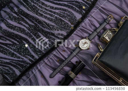 Rotating background of different fashionable women's accessories,things,watches,makeup brushes necklace,bracelet or jewelry on a pink background close-up top view. High quality 4k footage 113456830