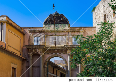 Cagliari historic gate of the former Royal Arsenal - Portale ex Regio Arsenale - nowadays entrance to the museums citadel in Sardinia Island, Italy. Cagliari historic gate of the former Royal Arsenal - Portale ex Regio Arsenale - nowadays entrance to the museums citadel in Sardinia Island, Italy. 113457720