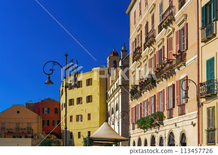 Cagliari historic colorful buildings facade with wooden window shutters at Santa Croce Bastion observation area in Sardinia Island, Italy. 113457726