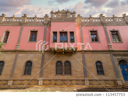 Warm sunset light bathes Prince Naguib Palace in soft glow, highlighting the intricate Mamluk Architecture, Cairo, Egypt 113457753