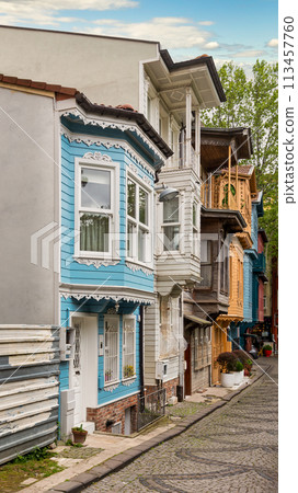 Cobblestone alley with colorful wooden houses, suited in Kuzguncuk neighborhood, Uskudar district, Istanbul, Turkey Cobblestone alley with colorful wooden houses, suited in Kuzguncuk neighborhood, Uskudar district, Istanbul, Turkey 113457760