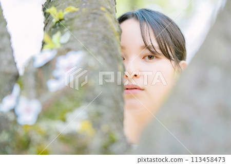 Cherry tree and young woman 113458473