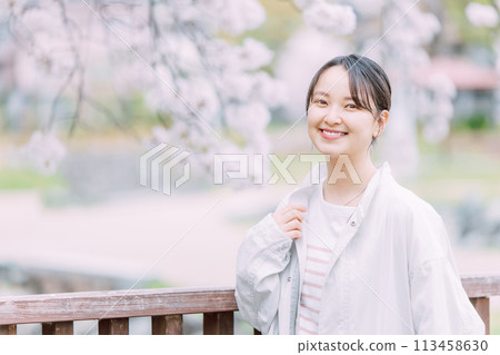 Cherry blossom and young woman Cherry blossom and young woman 113458630