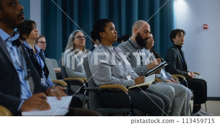 Media representative stands up and asks questions during interview Media representative stands up and asks questions during interview 113459715