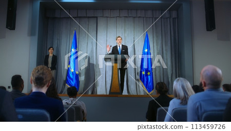 Confident politician makes an announcement, gives interview 113459726