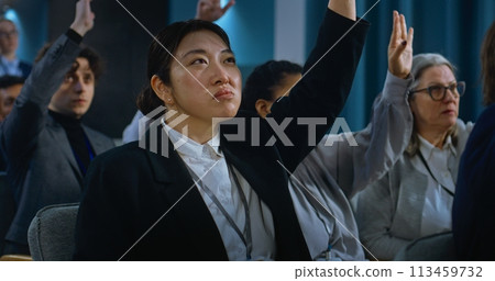 Asian female journalist asks question, listens the answer of politician Asian female journalist asks question, listens the answer of politician 113459732