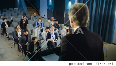 Back view of politician or activist pronouncing speech during press campaign 113459761