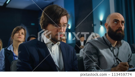 Diverse media workers raise hands during press campaign in the conference room 113459774