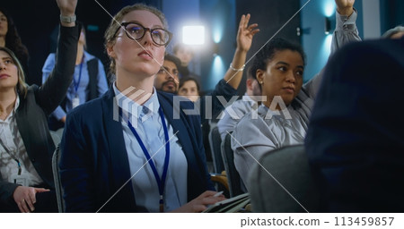 Female journalist asks question, writes down answer from activist or politician Female journalist asks question, writes down answer from activist or politician 113459857